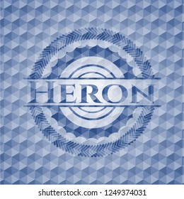 Heron blue badge with geometric pattern background.