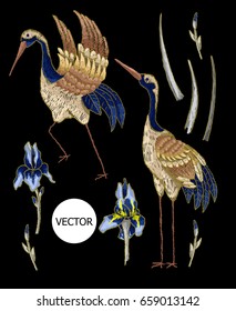 Heron-crane embroidery with iris flowers. Vector fashion embroidered design on black background for textile.