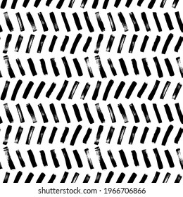 Herringbone brush strokes vector seamless pattern. Chevron texture or wallpaper. Grunge geometric pattern, hand drawn tribal vector background. Graphic diagonal brush strokes, zig zag ink illustration