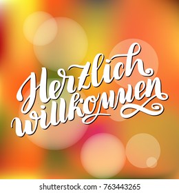 Herzlich willkommen. Welcome. Traditional German Oktoberfest bier festival . Vector hand-drawn brush lettering illustration on orange blurred background