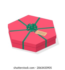 Hexagon shape low Christmas gift box isolated. Isometric 3d red surprise gift box with green satin ribbon bow and greeting card tag. Holiday present package isometric 3d vector illustration.