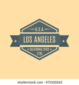 Hexagonal emblem with the text of the city of Los Angeles in a retro style, isolated on a yellow background, vector illustration.