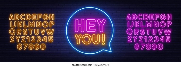 Hey you neon sign on brick wall background.