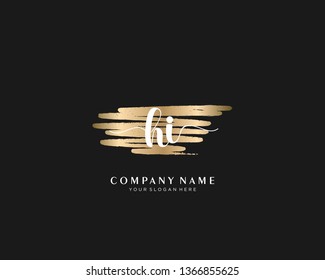 HI initial handwriting logo with brush gold color template vector