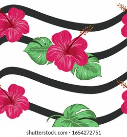 Hibiscus flower with tropical leaves.