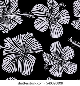 Hibiscus flowers on black background in neutral colors.