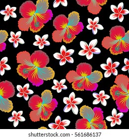 Hibiscus flowers seamless pattern on a black background in yellow, orange and neutral colors.