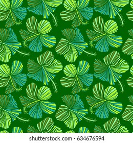 Hibiscus pattern. Seamless pattern of tropical flowers. Vector illustration on green background.