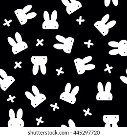 Hidden white rabbit with cross pattern on black background