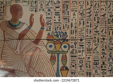 Hieroglypic colourful carving paintings on wall at the ancient egyptian