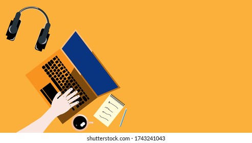 High angle view of a work space isolated over orange background