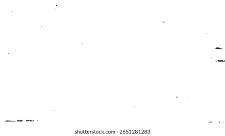 a high contrast image featuring black spots and lines scattered across a bright, white background surface