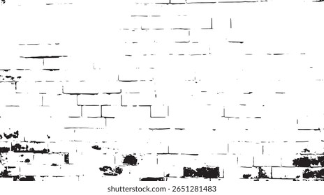 a high contrast monochrome image shows a brick wall with damage at the bottom giving it a textured look