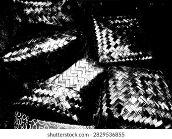 High contrast monochrome vector illustration of stacked traditional woven bamboo baskets or besek boxes.
