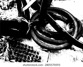 High contrast stencil illustration of a coiled rubber well bucket rope and brush. Abstract industrial grunge vector pattern of utility tools graphic.