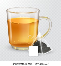 High detailed vector illustration of transparent cup with black or green tea isolated on transparent background. Pyramidal tea bag with label.