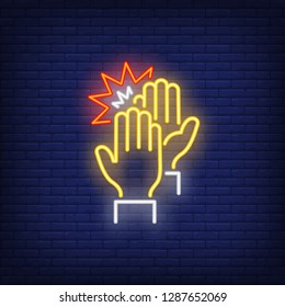 High five neon sign. Glowing neon two hands on brick wall background. Vector illustration can be used for gesturing, communication, chatting