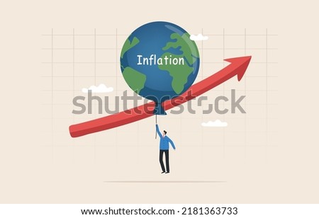 High global inflation. FED interest rate hike. floating interest. Global economic crisis. economic slow down, inflation high up. Balloon with the symbol of the world map floats higher.