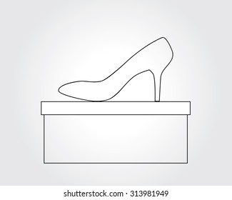 high heeled shoe on shoe box in a simple line art style.  grey background

