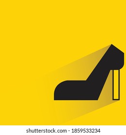 high heels with shadow on yellow background