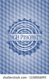 High Priority blue polygonal badge.