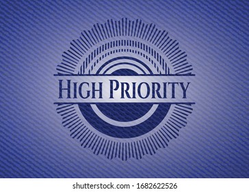 High Priority emblem with jean high quality background. Vector Illustration. Detailed.