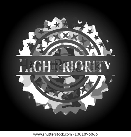 High Priority on grey camouflaged texture