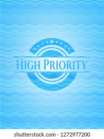 High Priority sky blue water wave emblem background.