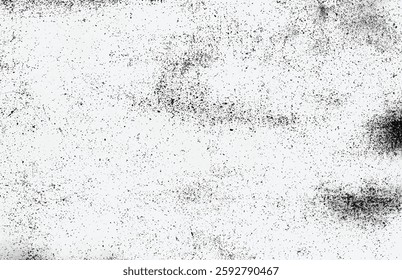 High-contrast grunge texture with black speckles and scratches on a white background. Perfect for overlays and vintage effects.