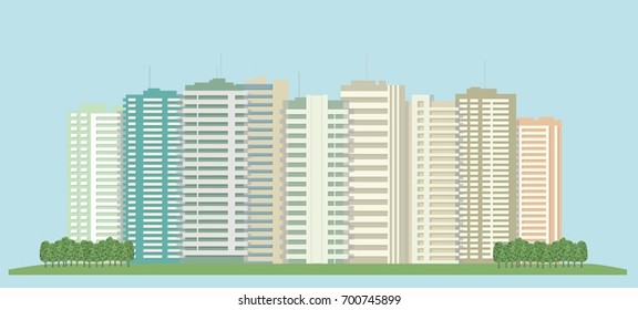 High-rise buildings of the city and a green field.