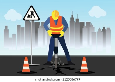 Highway maintenance worker working with drilling machine, road construction worker with equipment