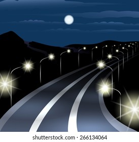 Highway at midnight against mountain landscape.