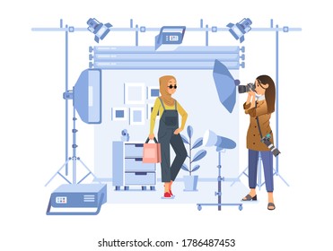 hijab woman doing a photoshoot with a female photographer in studio with all equipment for photoshoot. used for website image, poster and other
