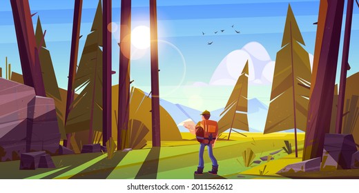 Hiker man in forest with mountains on horizon