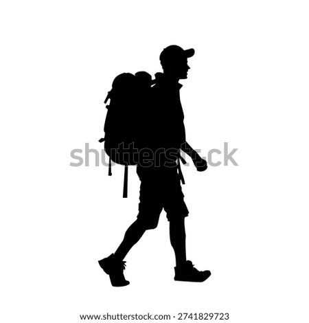 Hiker walking alone in profile with large backpack, walking stick, outdoors