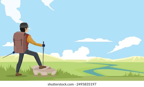 Hikers standing on rocks on top of mountain. Landscape background of grassland and curving river. With mountains under blue sky and white clouds.