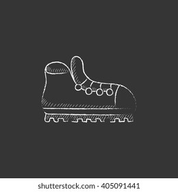 Hiking boot with crampons. Drawn in chalk icon.