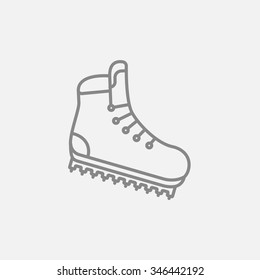 Hiking boot with crampons line icon for web, mobile and infographics. Vector dark grey icon isolated on light grey background.