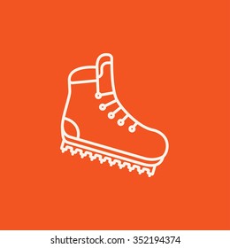 Hiking boot with crampons line icon for web, mobile and infographics. Vector white icon isolated on red background.