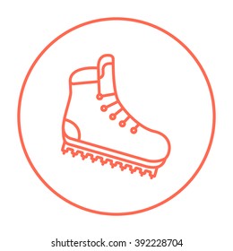 Hiking boot with crampons line icon.