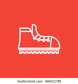 Hiking boot with crampons line icon.