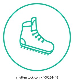 Hiking boot with crampons line icon.