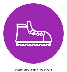 Hiking boot with crampons line icon.