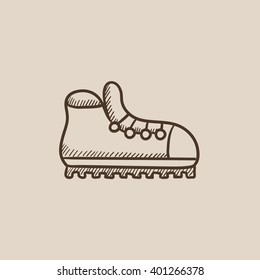 Hiking boot with crampons sketch icon.