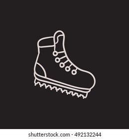 Hiking boot with crampons vector sketch icon isolated on background. Hand drawn Hiking boot with crampons icon. Hiking boot with crampons sketch icon for infographic, website or app.