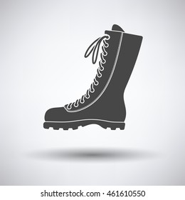 Hiking boot icon on gray background with round shadow. Vector illustration.