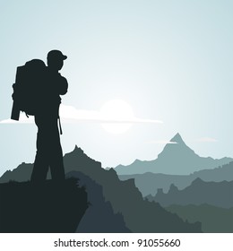 Hiking man with rucksack in mountain in the morning