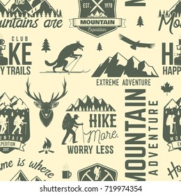 Hiking seamless pattern or background. Vector. Retro typography design with mountain, campfire, hiker and forest silhouette. For camping and hiking organizations. Old style wallpaper or wrapping.