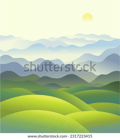 Hilly landscape with a panorama of mountain ranges in the fog.