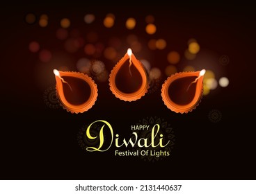 Hindu festival of lights celebration.oil lamp diya on Bokhe background . Diwali festival diya on mandala background . 